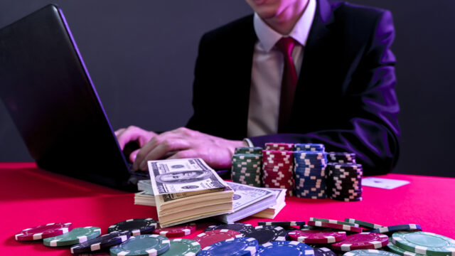 man is sitting at the poker table. poker game. online casino